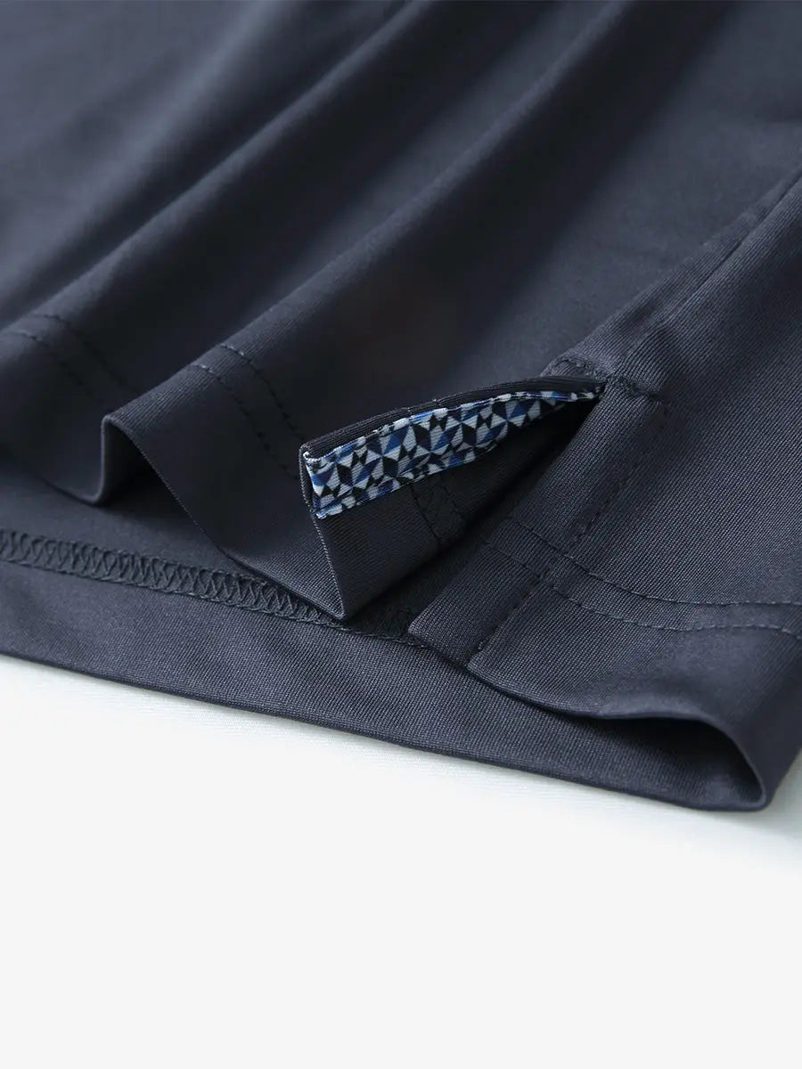 Close-up of side slit hem detail on DARK GREY Long Sleeve Solid Jersey Polo