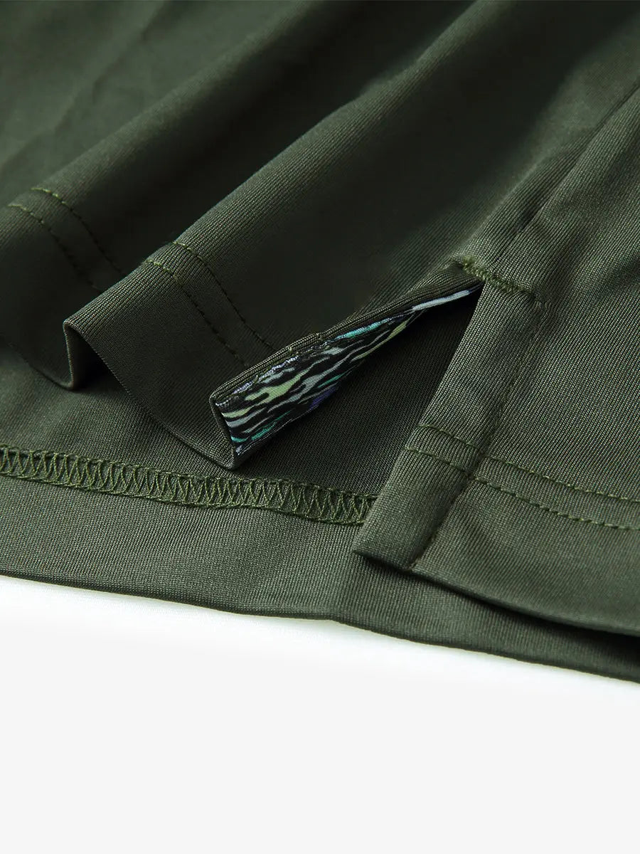 Close-up of side slit hem detail on OLIVE GREEN Long Sleeve Solid Jersey Polo