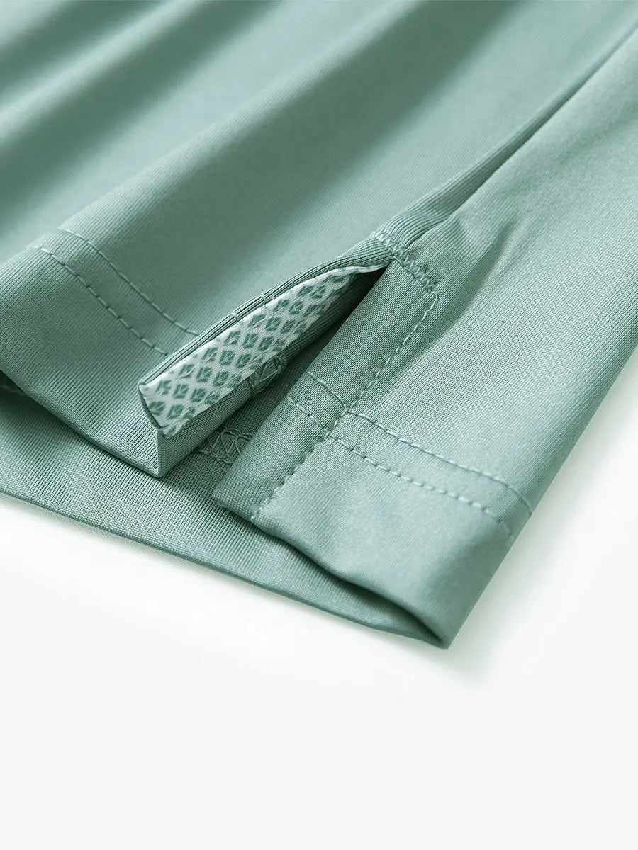 Close-up of side slit hem detail on BERYL GREEN Long Sleeve Solid Jersey Polo