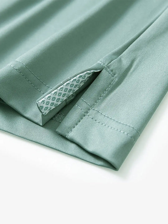 Close-up of side slit hem detail on BERYL GREEN Long Sleeve Solid Jersey Polo