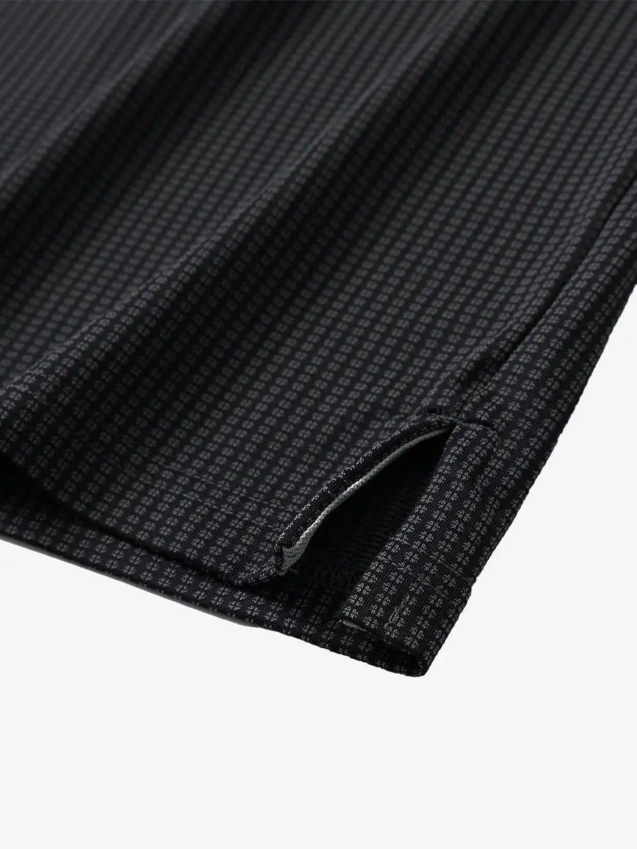 Close-up of hem slit detail on BLACK Elegant Performance Jacquard Polo
