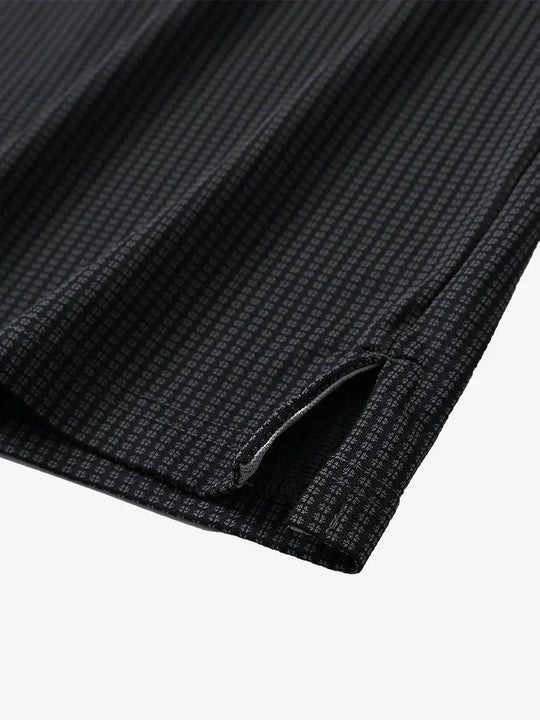 Close-up of hem slit detail on BLACK Elegant Performance Jacquard Polo