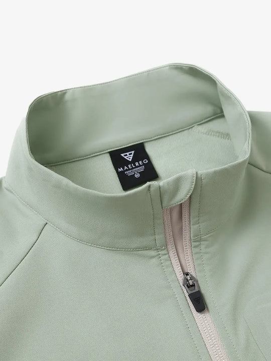 Detail view of the light green windproof golf vest, focusing on the collar design and zipper closure.