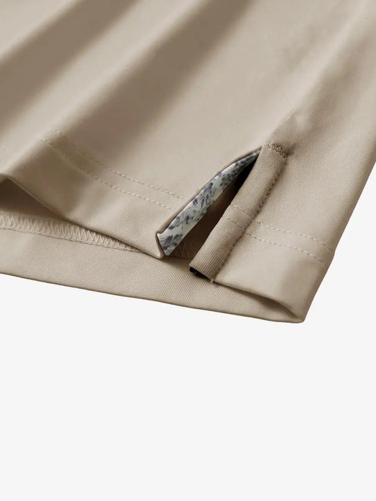 Close-up of side slit detail on the Dark Khaki Everyday Classic Solid Polo hem