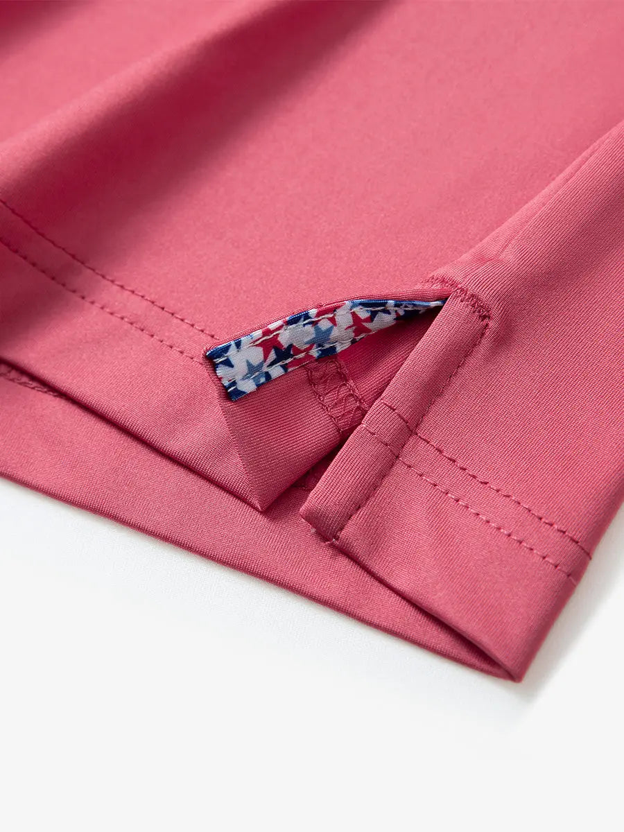 Close-up of side slit hem detail on CRANBERRY Long Sleeve Solid Jersey Polo