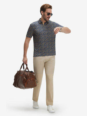 Full-body front view of model wearing the yellow duck 4 way stretch print collared polo shirt, showing the complete outfit