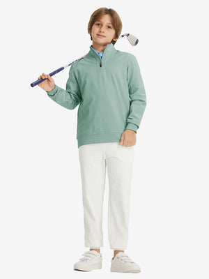 Full body model holding a golf club, styled in youth winter micro-fleece quarter zip pullover with dusty green