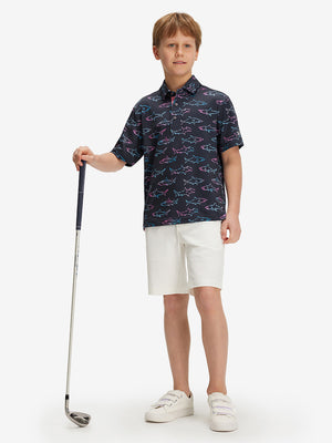 Full front: boy in ombre shark performance print boys golf polo holding golf club.