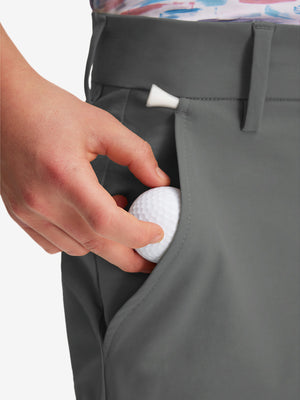 Detail: pocket of dark grey boys lightweight dry fit flat front golf shorts