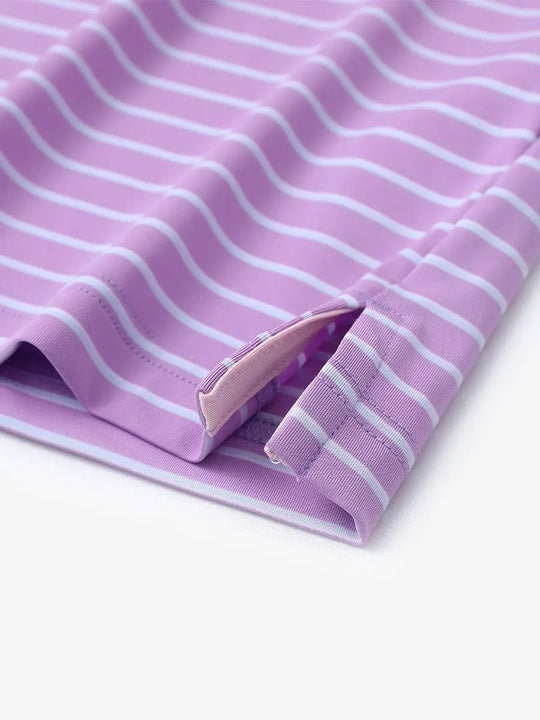 Close-up of side slit hem on LILAC/LIGHT BLUE STRIPE Polo — neat finishing touch