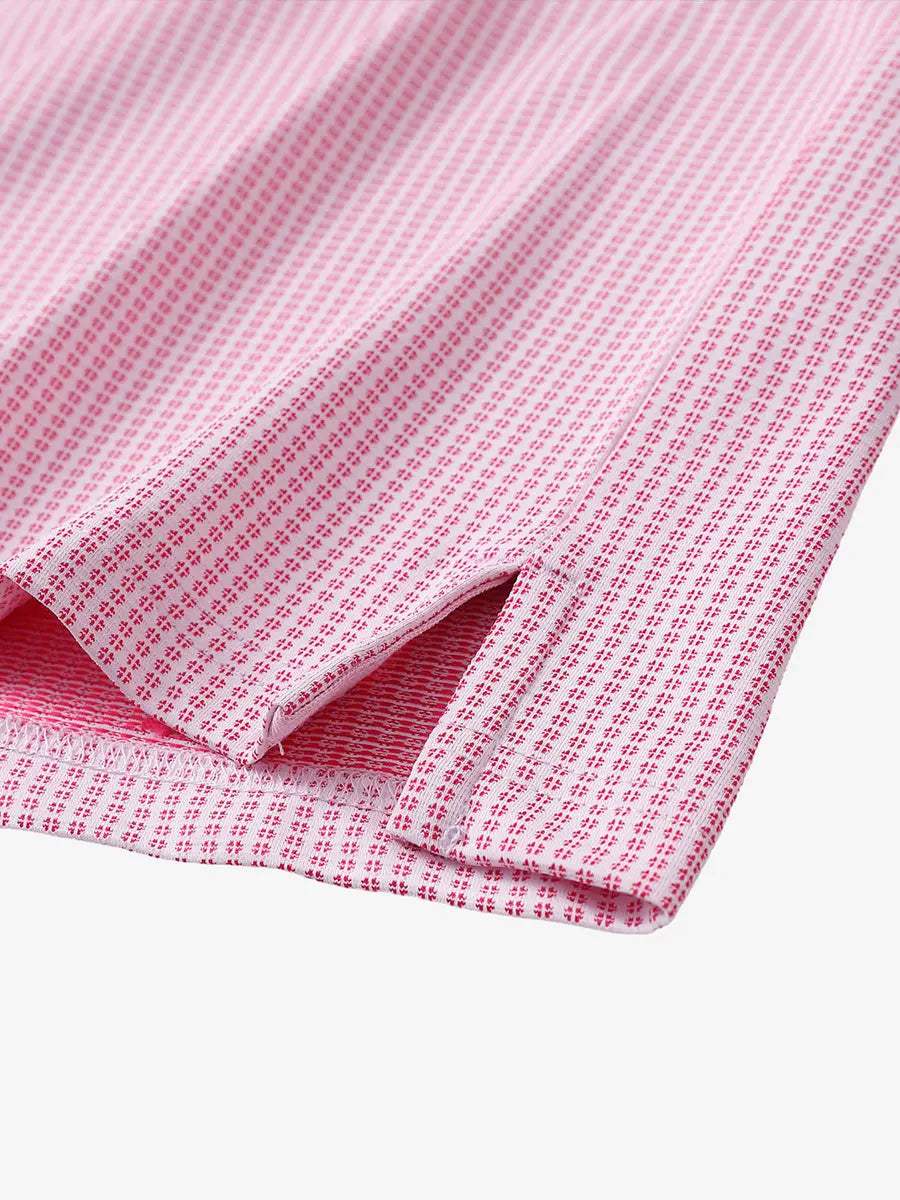 Close-up detail of hem slit on ROSE Elegant Performance Jacquard Polo