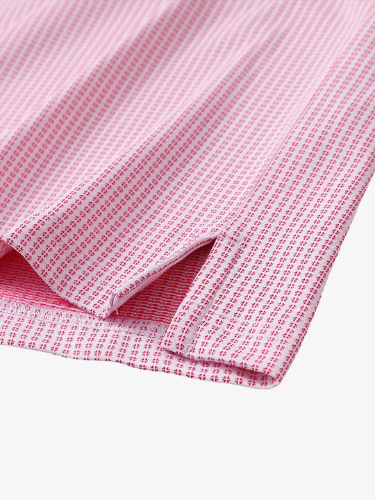 Close-up detail of hem slit on ROSE Elegant Performance Jacquard Polo