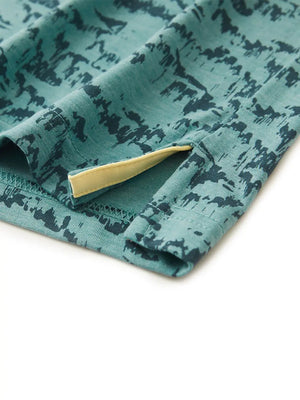 Hem slit detail of CYAN MASSIF Popular Heather Print Polo highlighting stitching and finish