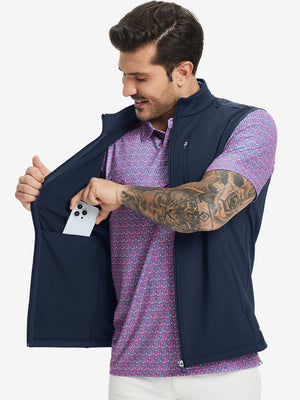 Close-up of water-resistant fleece golf vests pocket holding a phone, practical detail in navy