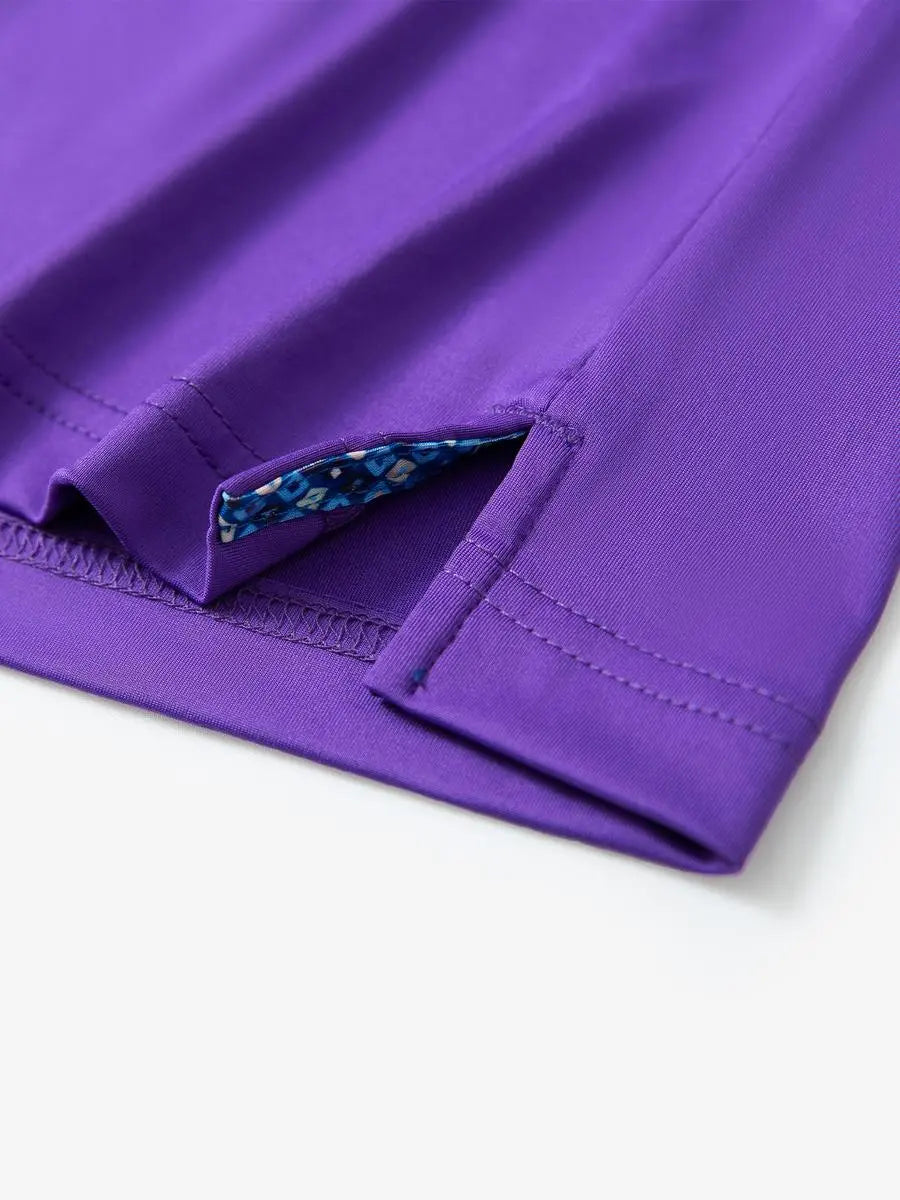 Close-up of side slit detail on the Purple Everyday Classic Solid Polo hem