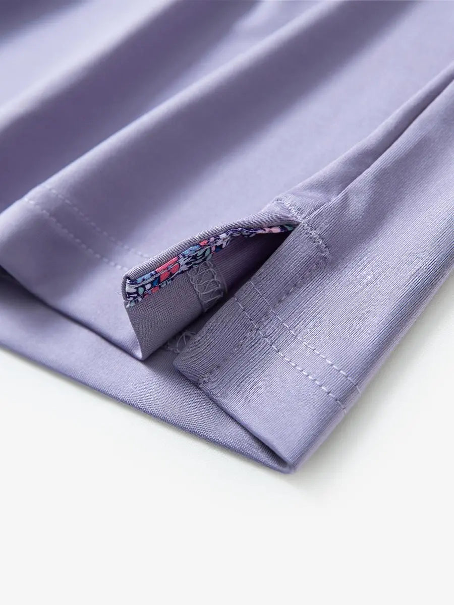 Close-up of side slit detail on the Lavender Everyday Classic Solid Polo hem