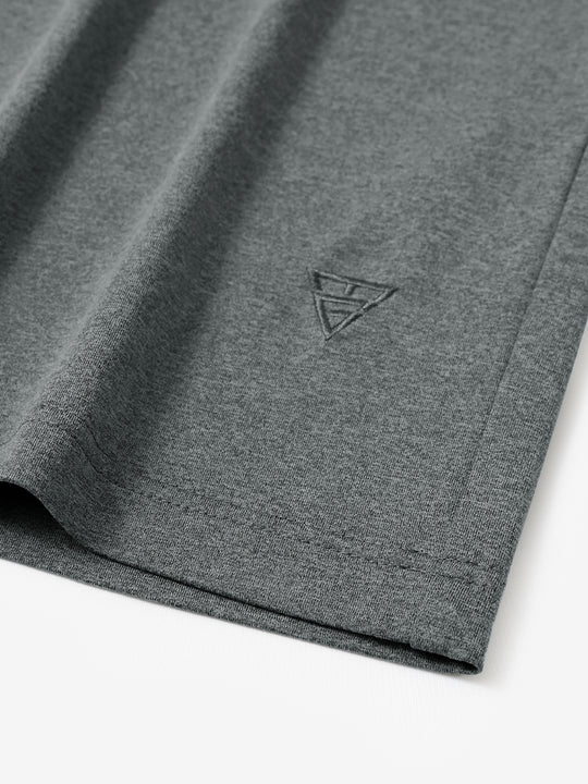 Hem detail of Men’s Long Sleeve Mock Turtleneck Shirt in Black Grey Heather, showcasing smooth finish.