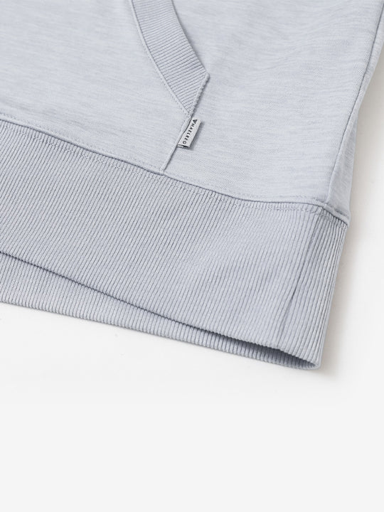 Hem detail of the Brick Heather Athletic Golf Hoodie, highlighting clean stitching and neat design.