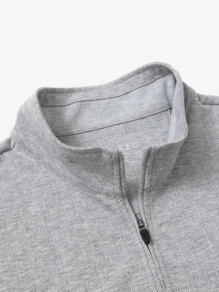 Close-up of collar and interior logo detail on LIGHT GRAY HERRINGBONE Premium Jacquard Quarter Zip Pullover.								
