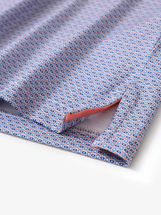 Hem slit detail of MAELREG Performance Jersey Print Polo in Blue White Oval – comfort & movement