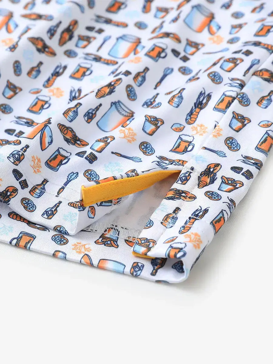 Detailed close-up of side hem slit on WHITE ORANGE PICNIC Performance Print Boys Golf Polo for comfort
