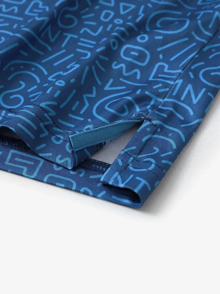Detailed close-up of side hem slit on BLUE GRAFFITI Performance Print Boys Golf Polo for breathability