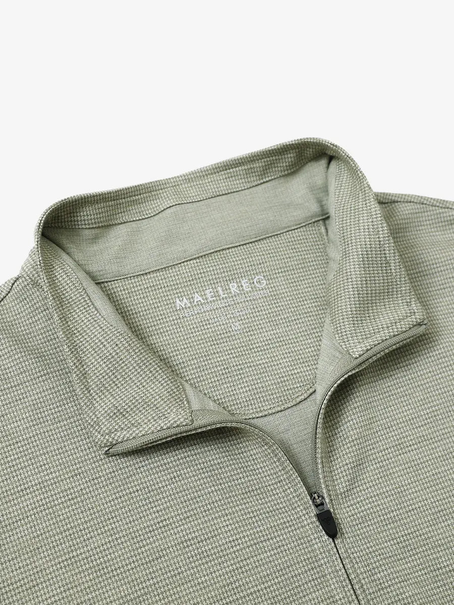 Close-up of collar and interior logo detail on SAGE GREEN HOUNDSTOOTH Premium Jacquard Quarter Zip Pullover.								
