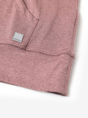 Hemline detail of the Quarter Zip Hoodie in Pink Heather, showing neat edges and fine craftsmanship.