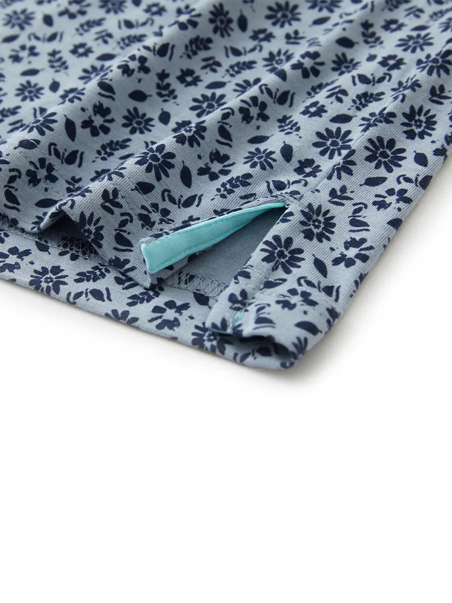 Hem slit detail of GRAYISH BLUE FLOWER Popular Heather Print Polo highlighting stitching and finish