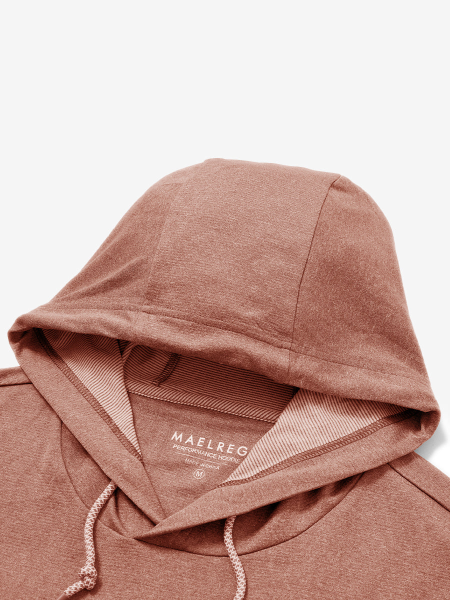 Hood detail of the classic heather pullover hoodie in brick melange, showcasing fabric and stitching.