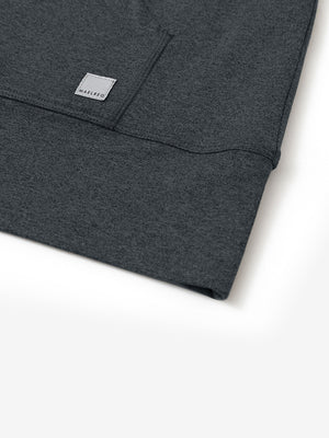Hemline detail of the Quarter Zip Hoodie in Dark Grey Heather, showing neat edges and fine craftsmanship.