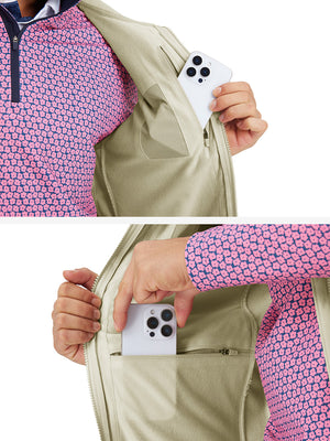 Close-up detail showing phone in the pocket of sleeveless softshell fleece outdoor vests with 6 pockets in light khaki