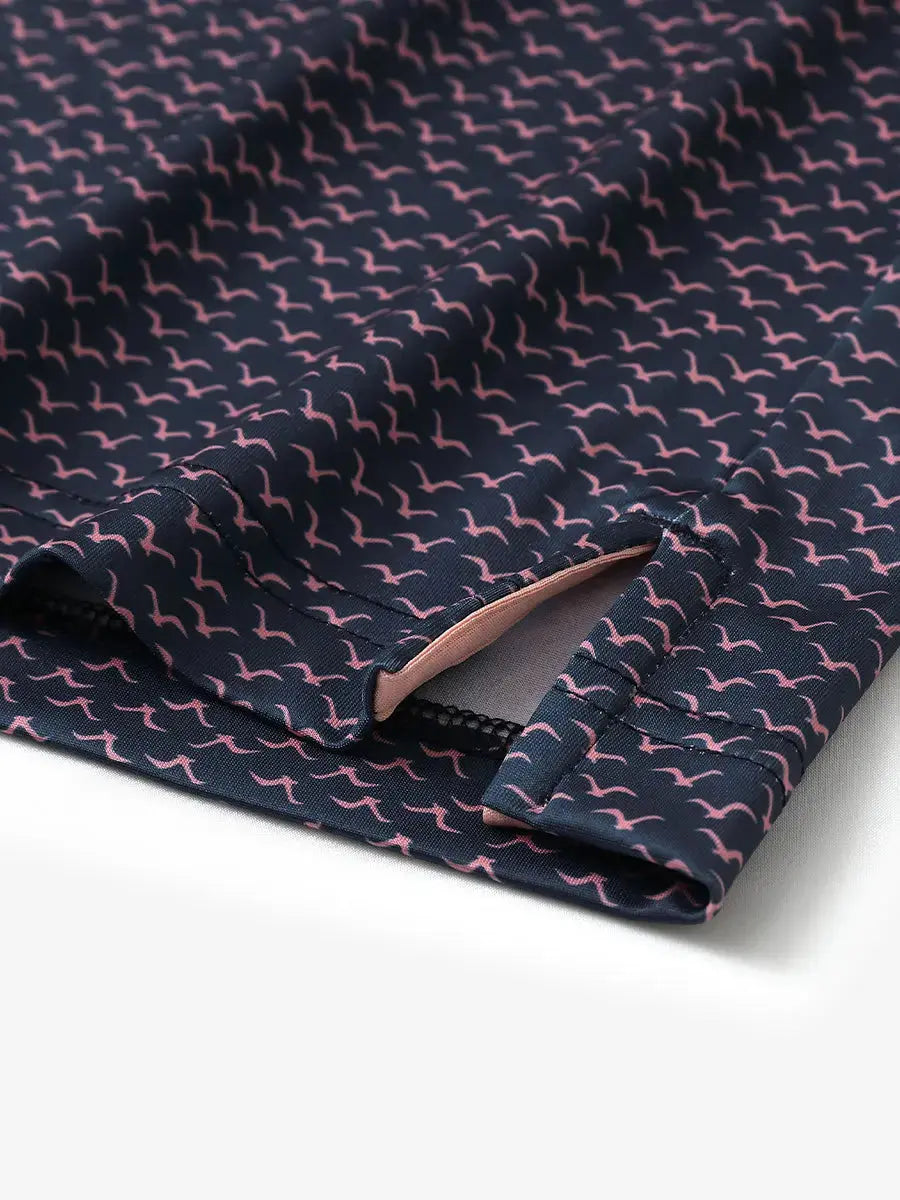 Hem slit detail of MAELREG Performance Jersey Print Polo in Navy Pink Seagull – comfort & movement
