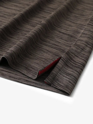Close-up of hem slit detail on DARK BROWN HEATHER Cool Heather Texture Polo