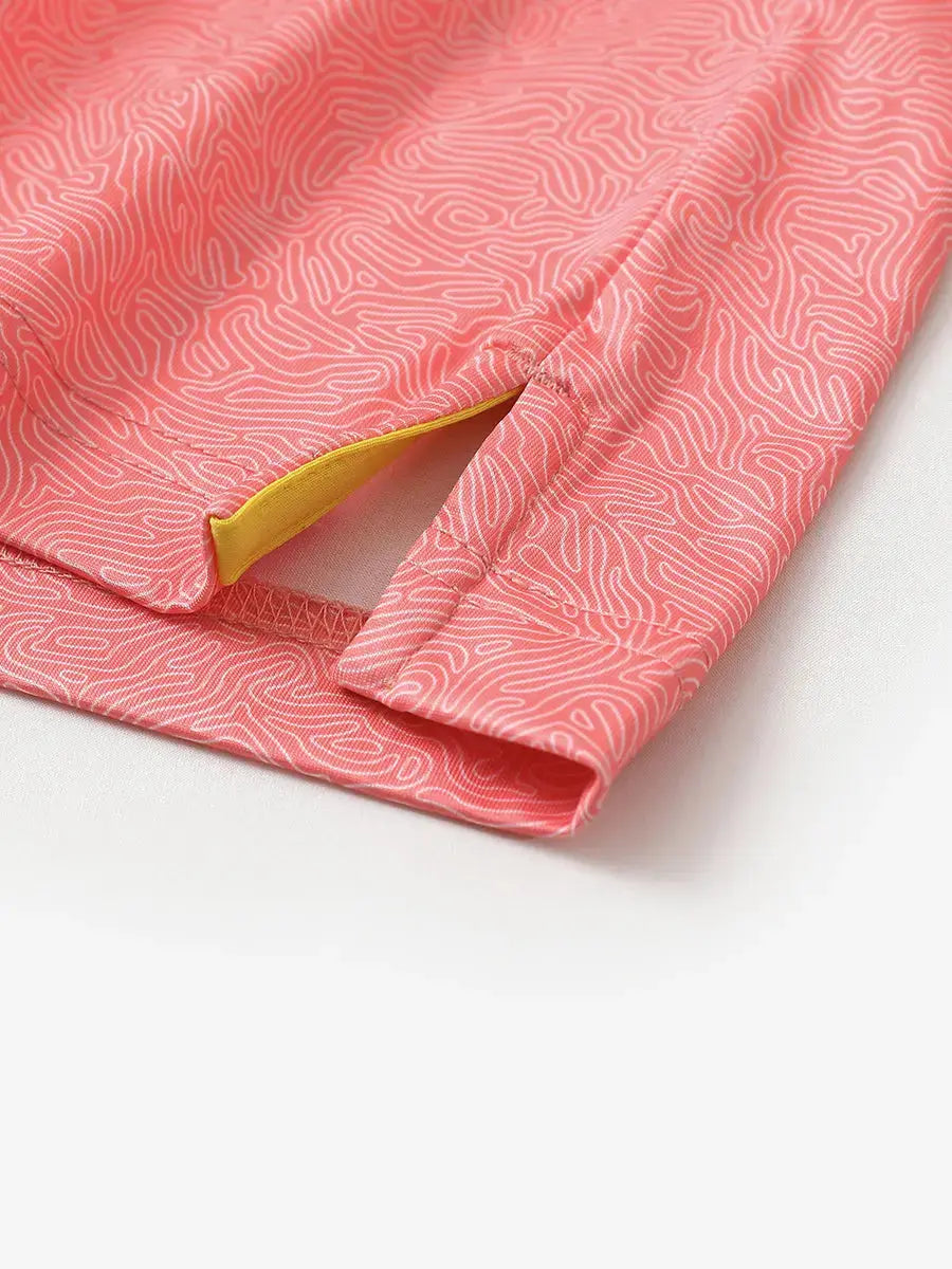 Close-up of side slit on CANDY PINK LINE polo, crafted for breathability and movement