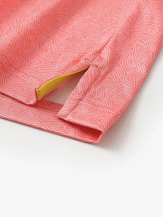 Close-up of side slit on CANDY PINK LINE polo, crafted for breathability and movement