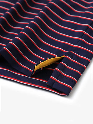 Detail shot of side slit hem on NAVY/RED STRIPE Polo with clean stripe alignment