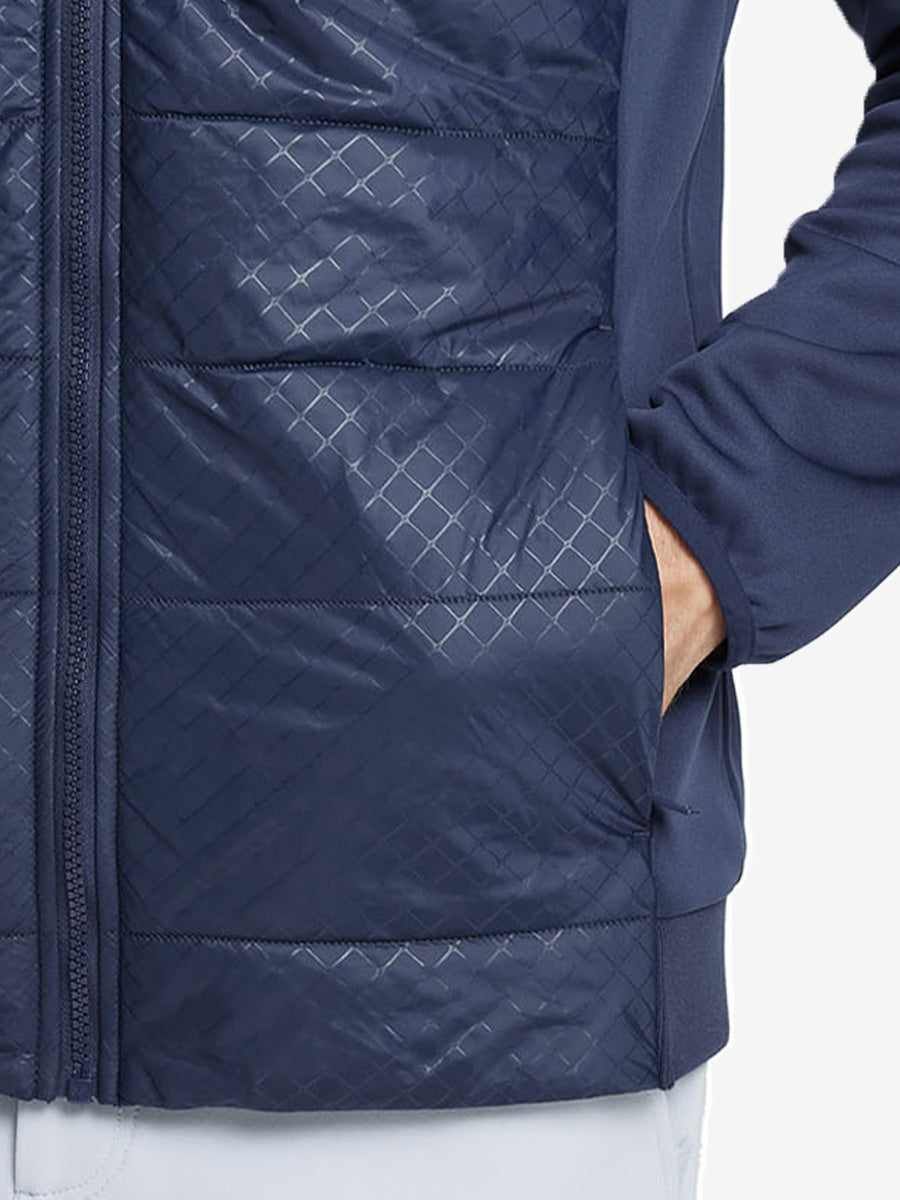 Hand in single pocket detail of the Navy Golf Fleece Winter Jacket, soft thermal material.