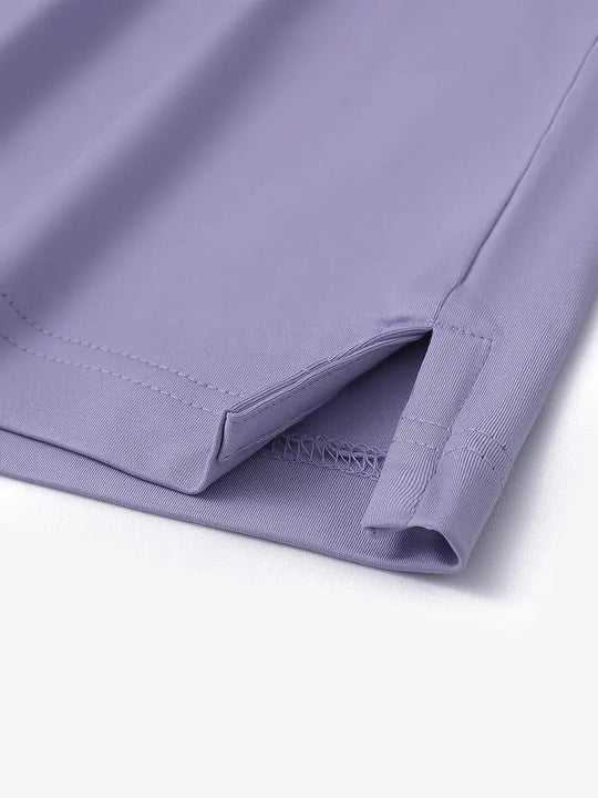 Close-up detail of hem slit on Everyday Solid Jersey Polo in LAVENDER, showcasing fine stitching.