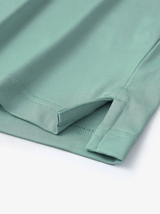 Hem slit detail of Everyday Collarless Jersey Shirt in BERYL GREEN.