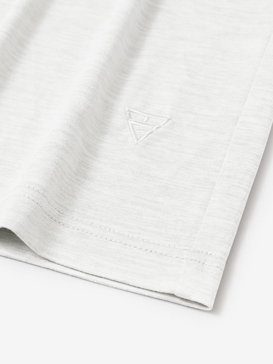 Hem detail of Men’s Long Sleeve Mock Turtleneck Shirt in White, showcasing smooth finish.