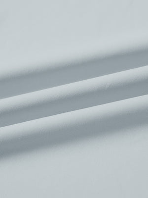 Close-up fabric detail of lightweight golf quarter zip pullover, smooth texture and breathable feel in misty grey