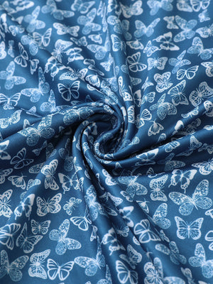 Fabric close-up of Everyday performance print polo with lightweight texture in blue white butterfly