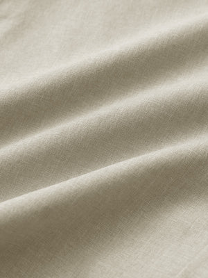 Close-up of khaki heather performance golf shorts fabric showing breathable texture.