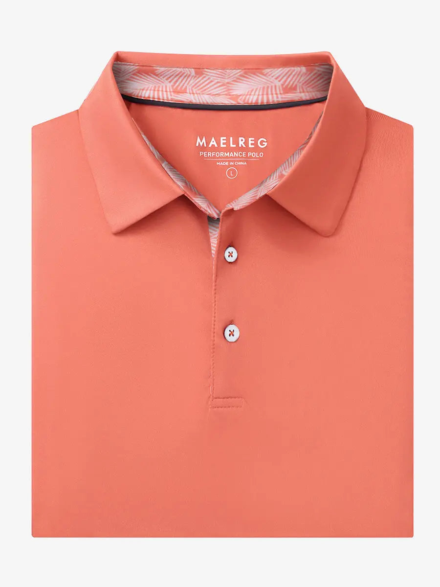 Folded Melon Everyday Classic Solid Polo neatly laid out for display