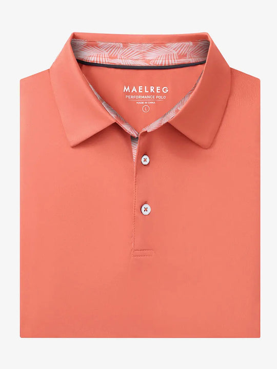 Folded Melon Everyday Classic Solid Polo neatly laid out for display