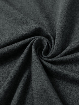 Close-up of fabric on men's long sleeve mock turtleneck shirt, soft knit texture with subtle stretch in dark grey heather