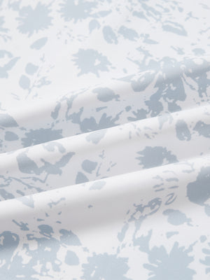 Close-up of grey splatter full print lightweight quarter zip pullover fabric, soft and breathable texture