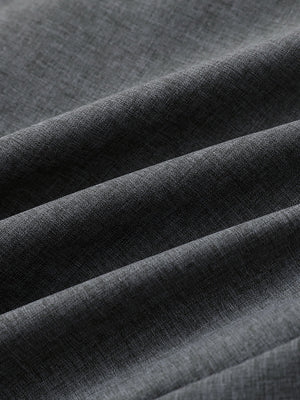 Close-up of dark grey heather performance golf shorts fabric showing breathable texture.