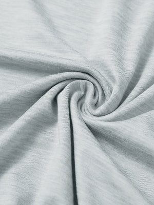 Close-up of fabric on men's long sleeve mock turtleneck shirt, soft knit texture with subtle stretch in light grey heather